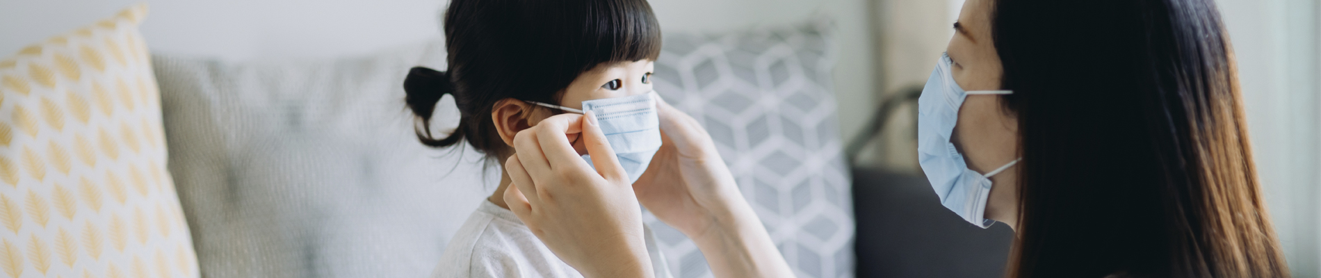 A family wearing face masks